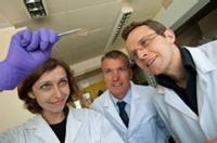 University of Warwick Chemistry PhD student Helena Stec with some ultra-thin gold film, watched by Professor Tim Jones, Chemistry, and Dr Ross Hatton, Chemistry